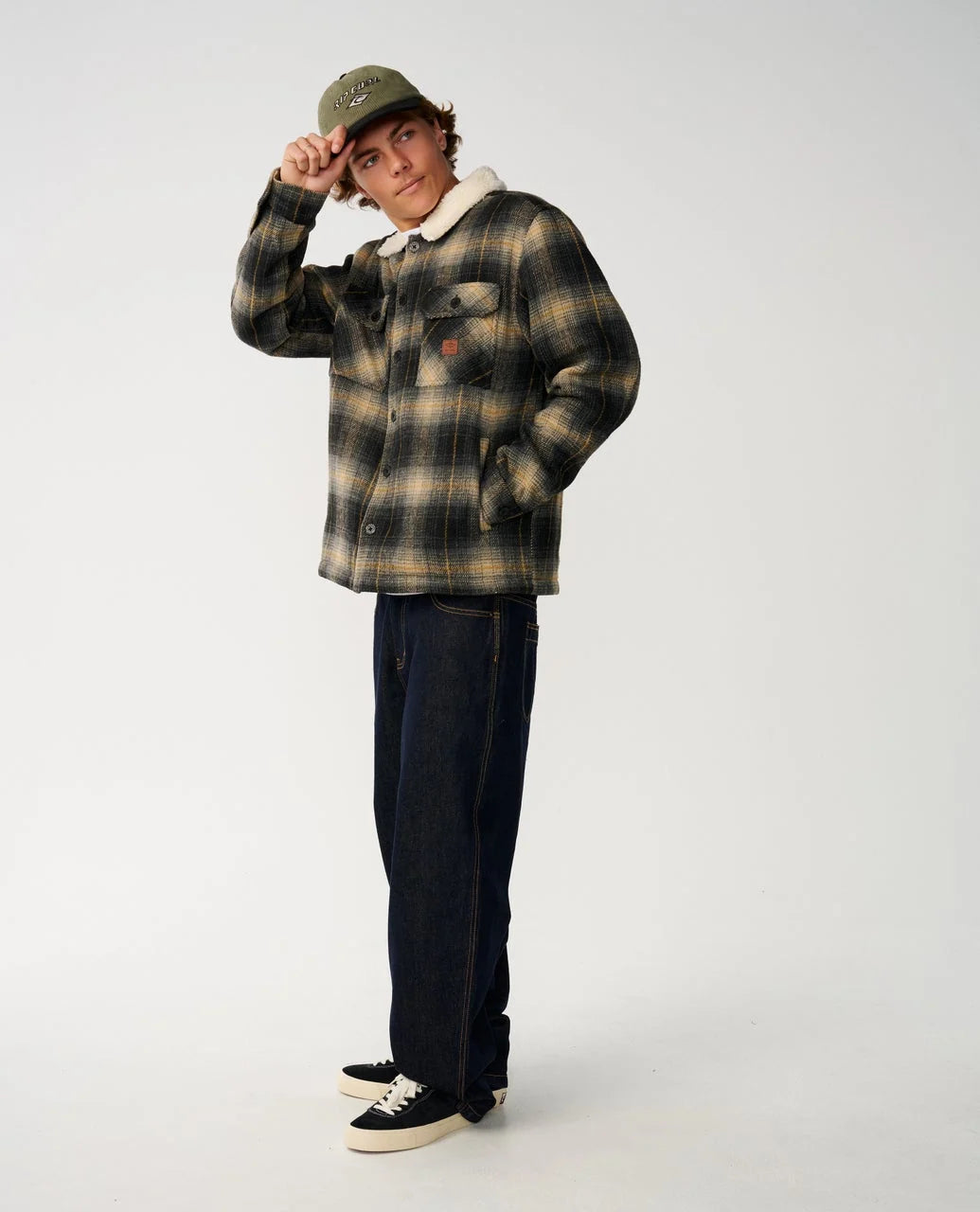 Plaid sherpa-collar snap jacket, chest snap placket and two chest pockets.