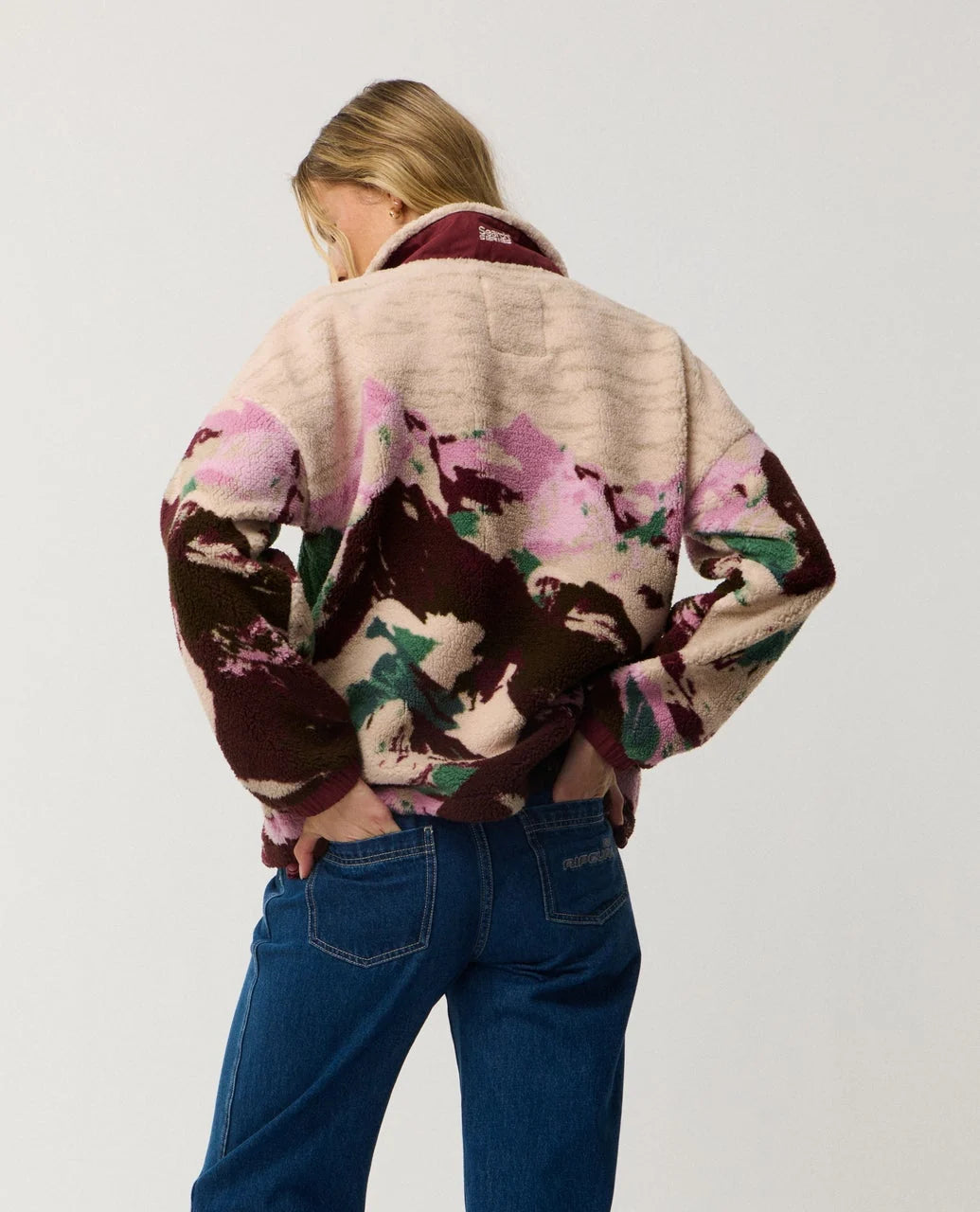 Polar fleece zip-through jacket back view with plum camo print and ribbed cuffs