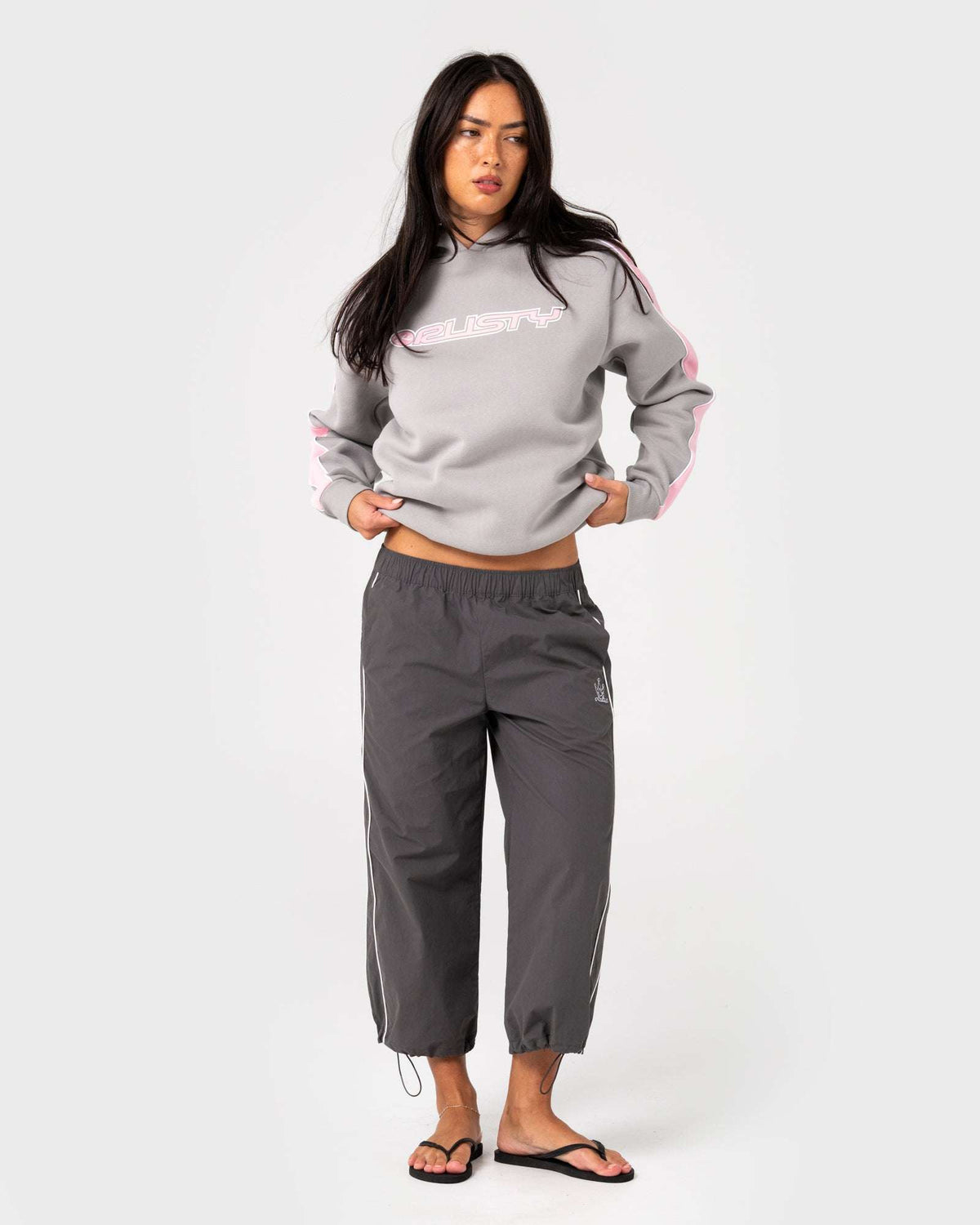 Oversized grey hooded fleece sweatshirt with pink logo graphic