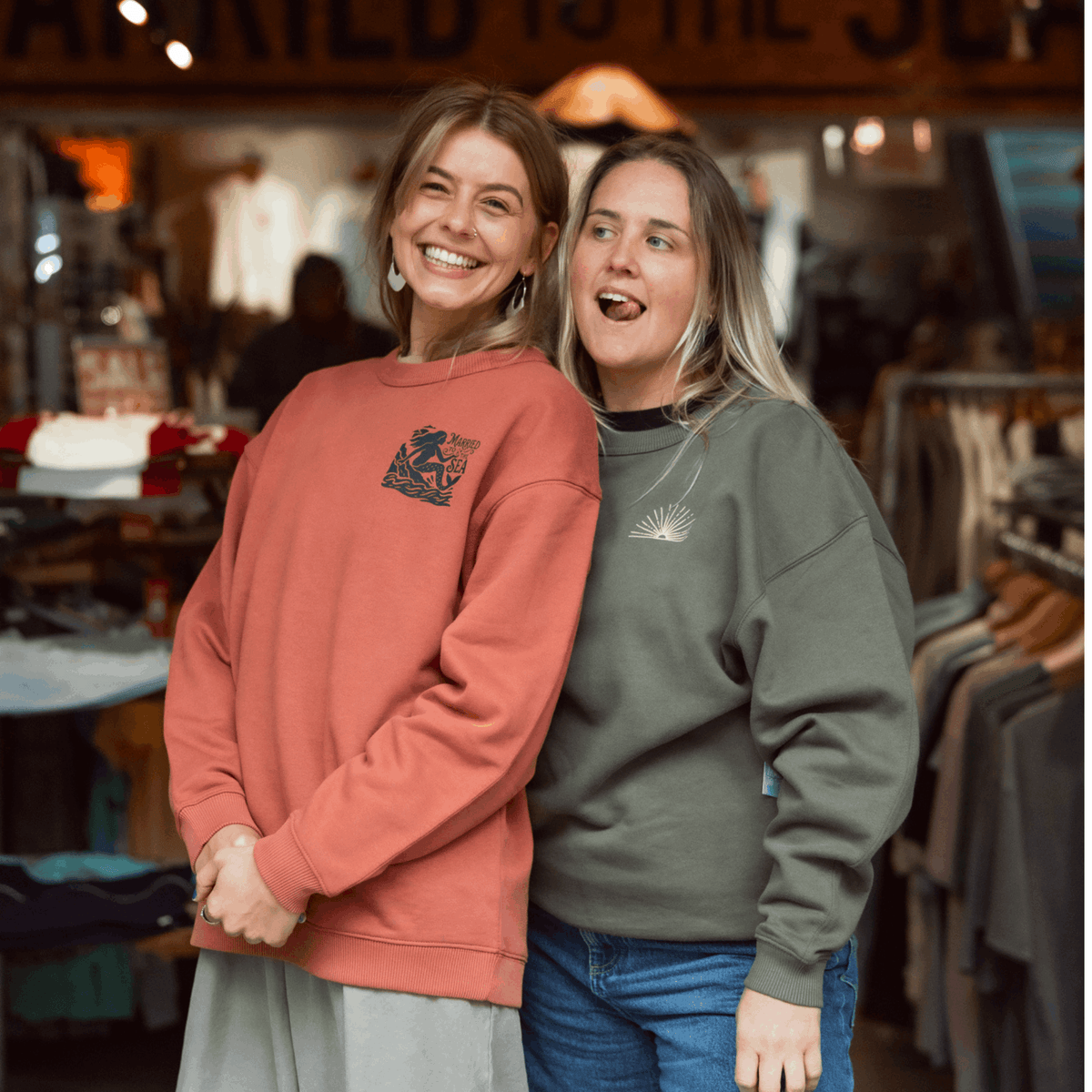 Rust-brown women’s crewneck sweatshirt with front graphic, long sleeves
