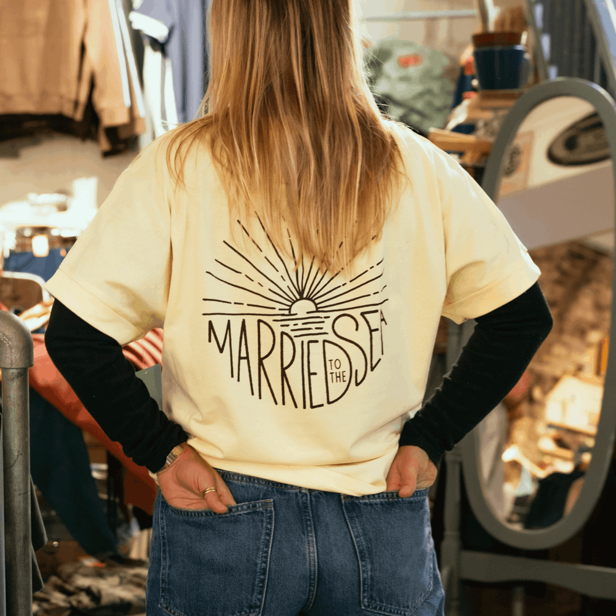 Butter yellow T-shirt with large back print reading "MARRIED TO THE SEA"