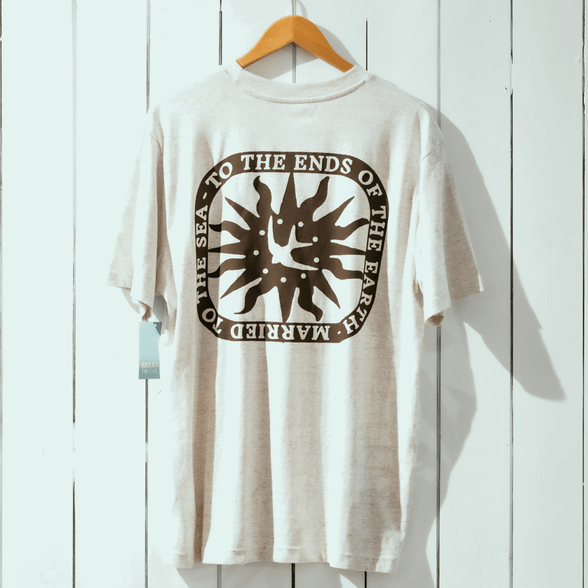 Light heather crew-neck T-shirt with large circular sea graphic on the front