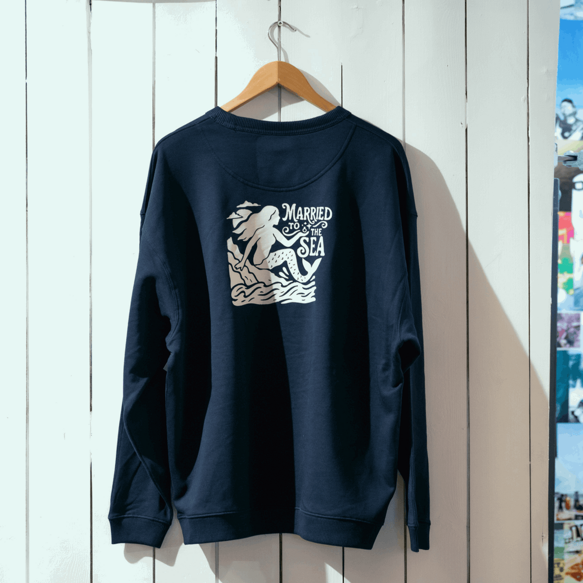 Dark navy womens crewneck sweatshirt with 'Married to the Sea' back graphic