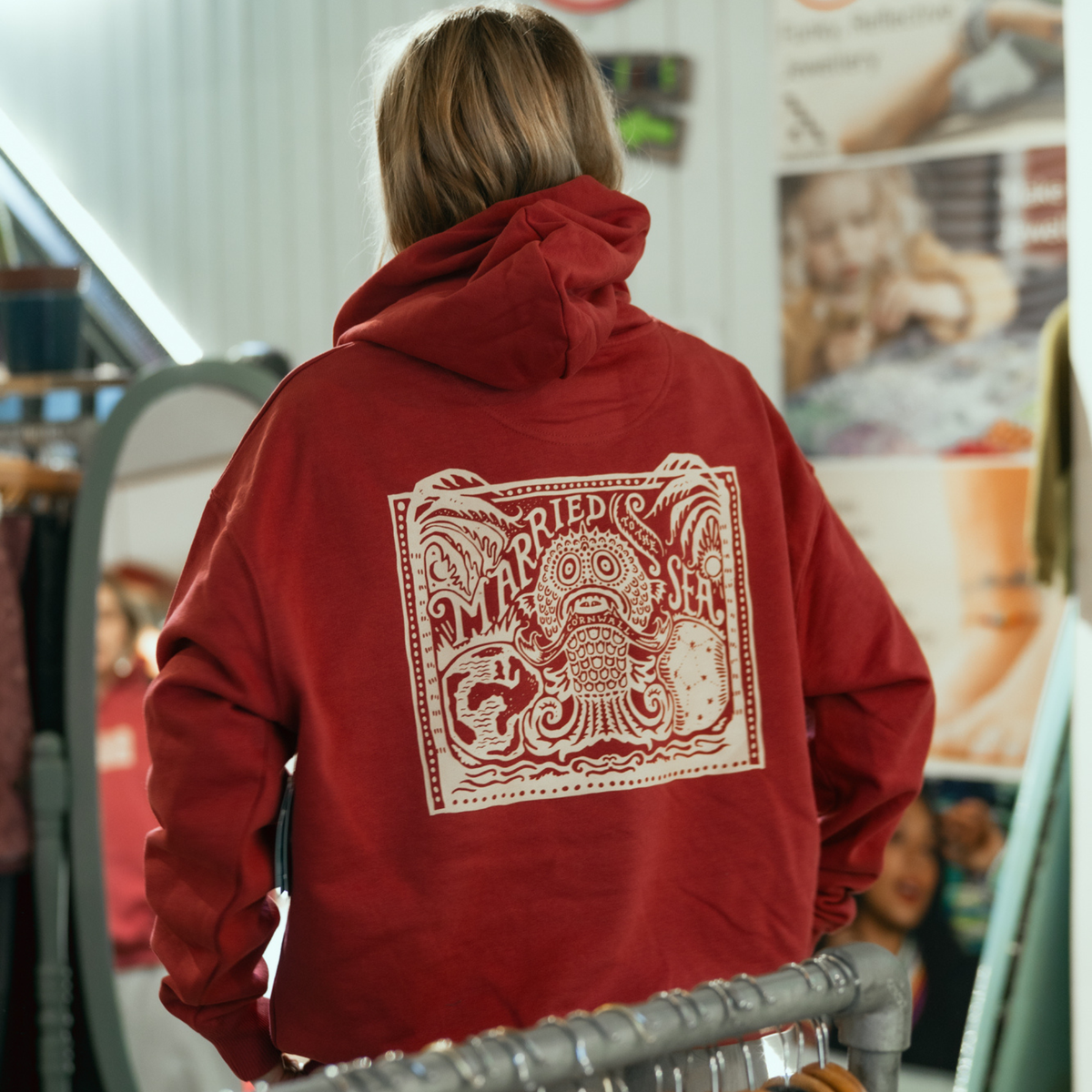 Red earth hooded sweatshirt with large back graphic and drawstring hood