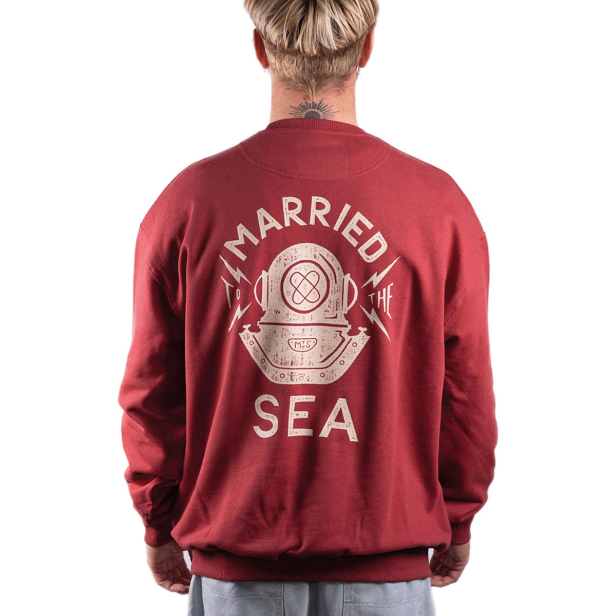 Red crewneck sweatshirt with large back graphic text and ribbed cuffs
